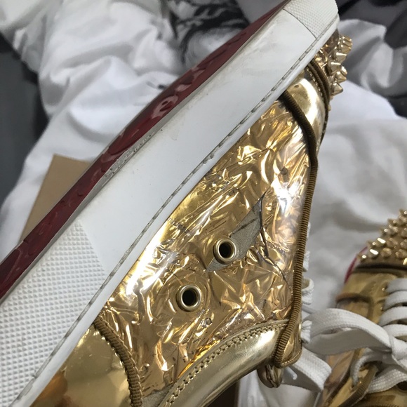 Size 6.5 Christian Louboutin gold, spike sneakers